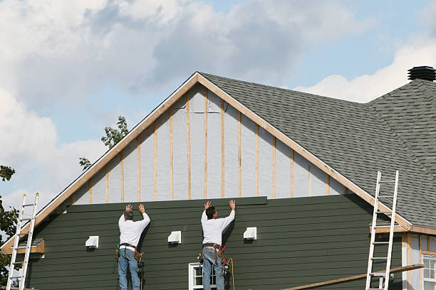 Professional Siding technician working in Ellicott City, MD